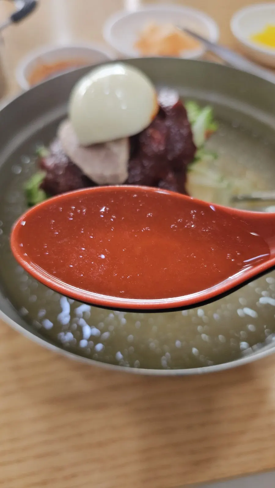 Close-up of water milmyeon toppings and icy broth