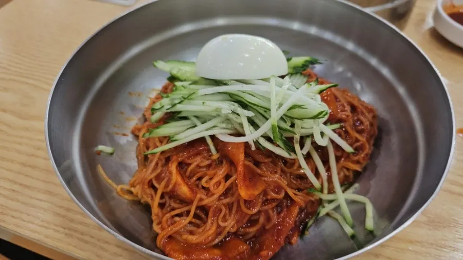 Water milmyeon and dumplings set together on the table