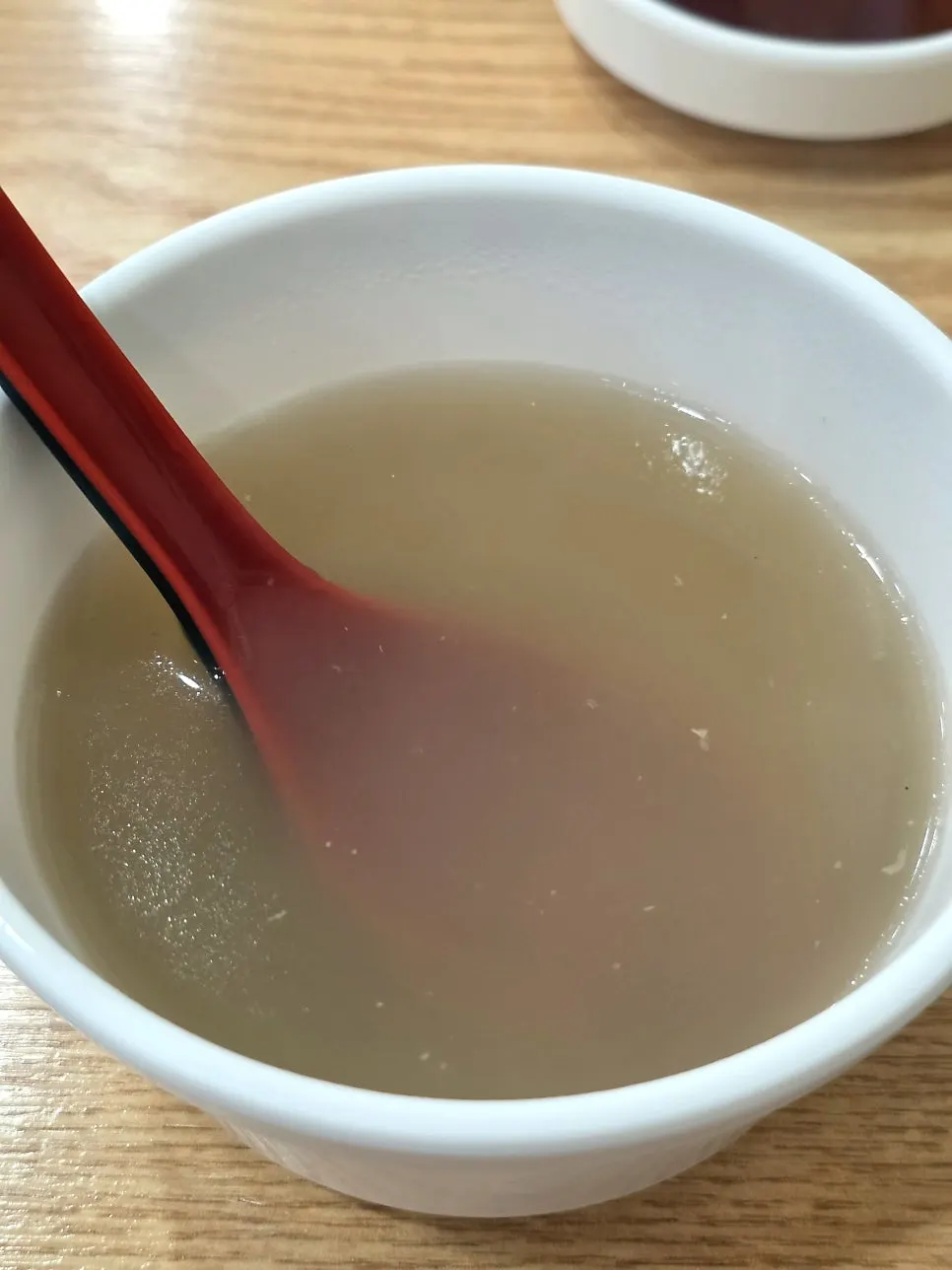 A cup of warm pre-meal broth