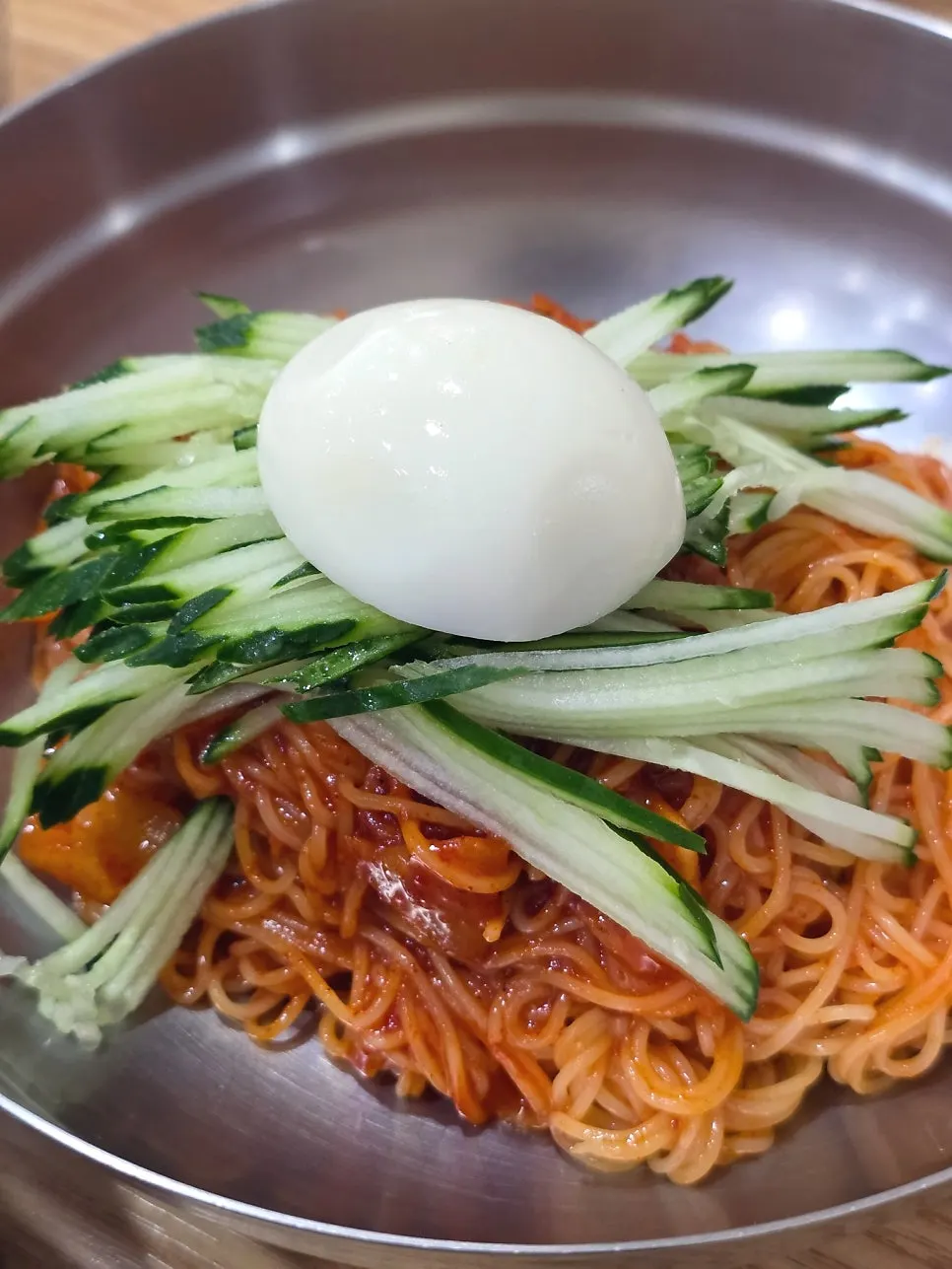 A bowl of bibim-milmyeon tossed with red sauce