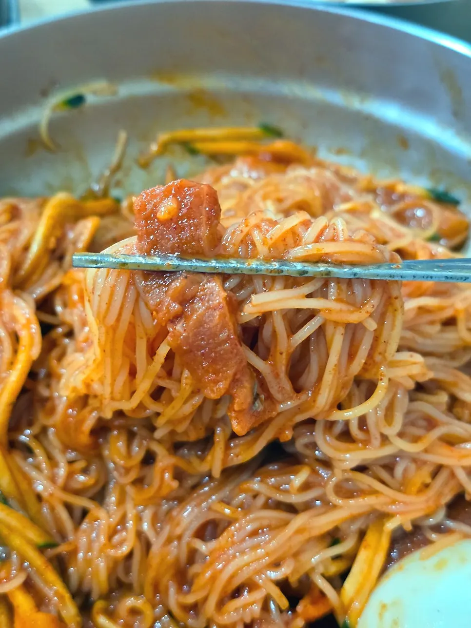 Bibim-milmyeon noodles mixed up with chopsticks