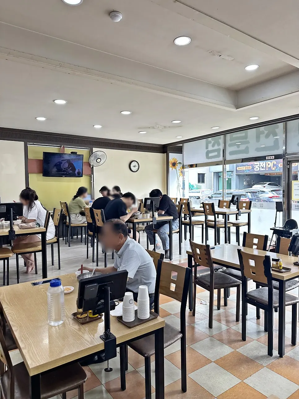 Interior of Samsam Milmyeon Main Branch busy with weekday lunch customers