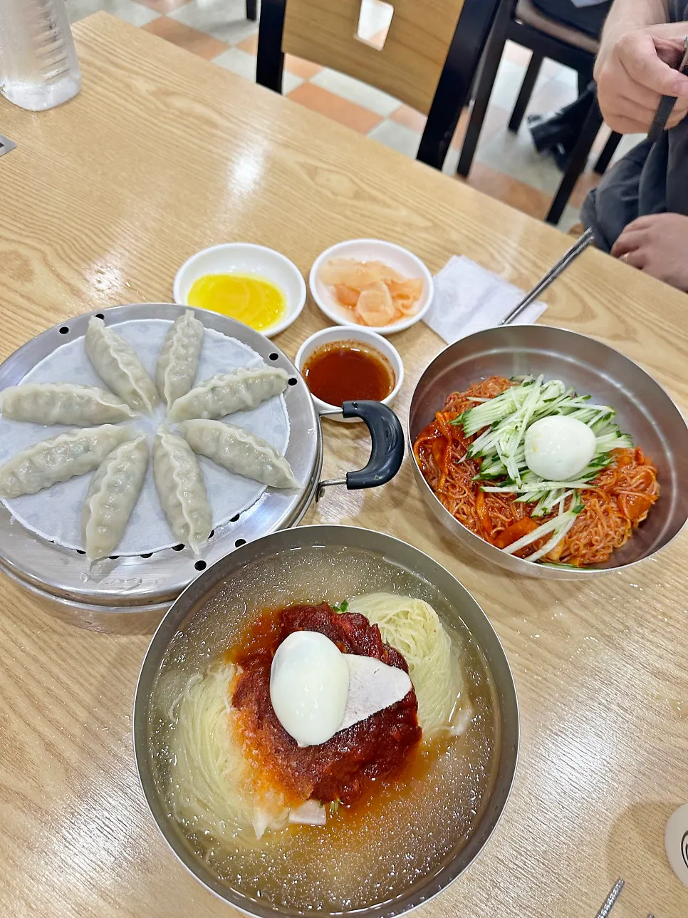 A double-portion milmyeon spread with an enormous amount of food