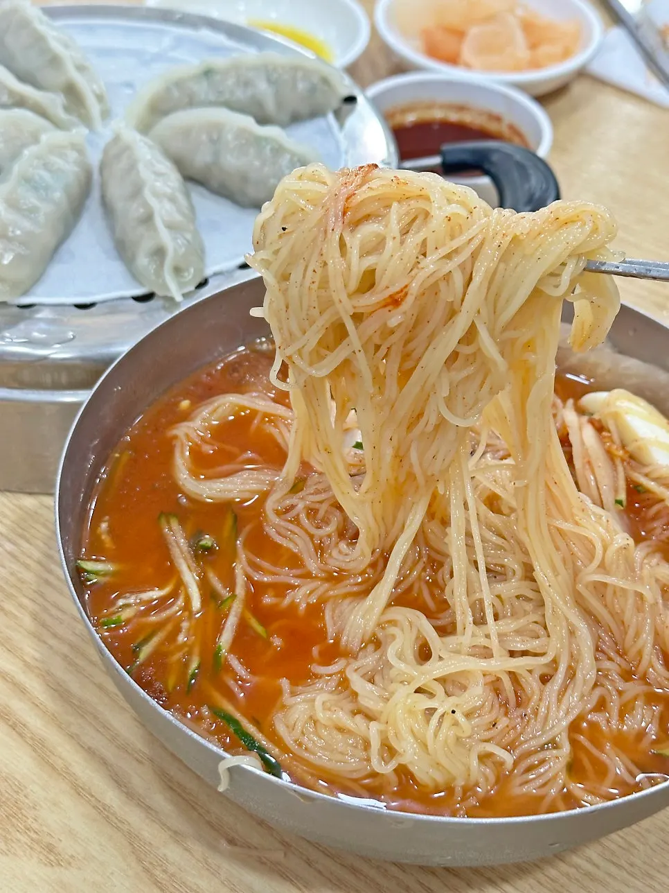 A bowl of Samsam Milmyeon's clean-tasting mul-milmyeon