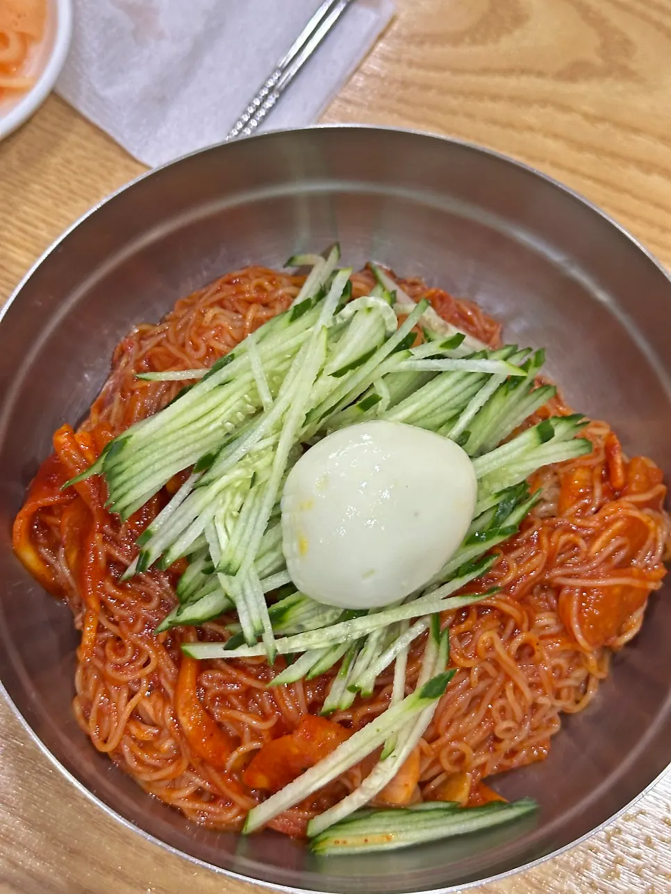 Double-portion bibim-milmyeon topped generously with cucumber