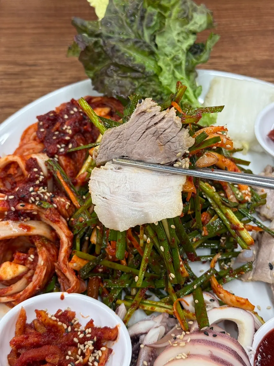 Squid bossam plate with pork, squid and chive salad