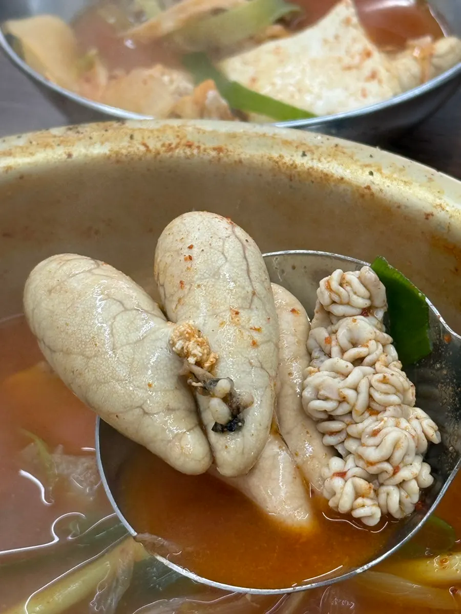 Spicy pollack soup served in a brass pot