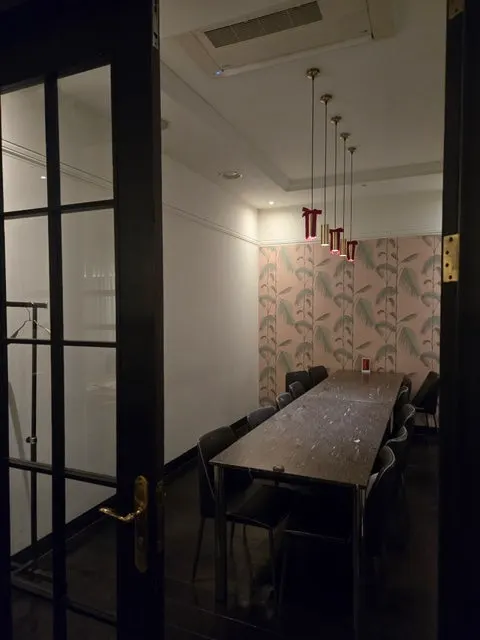 Dining hall table with a group of guests
