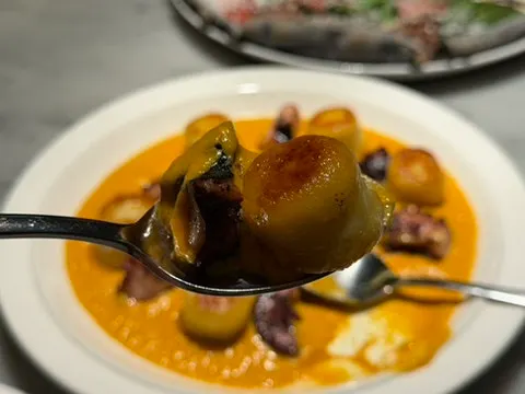 Fall season menu carrot puree octopus gnocchi