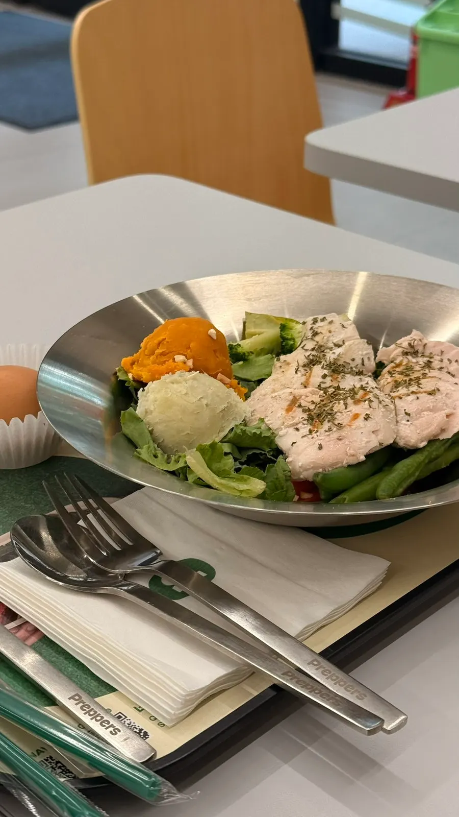 Close-up of grilled chicken breast with vegetables