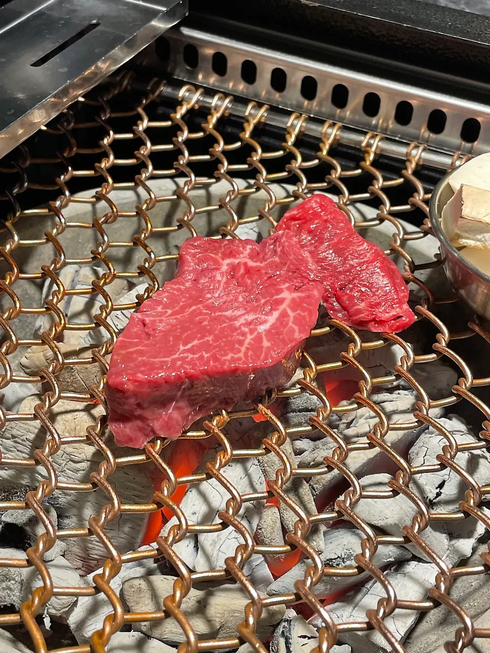 Tightly marbled hanwoo on the charcoal grill
