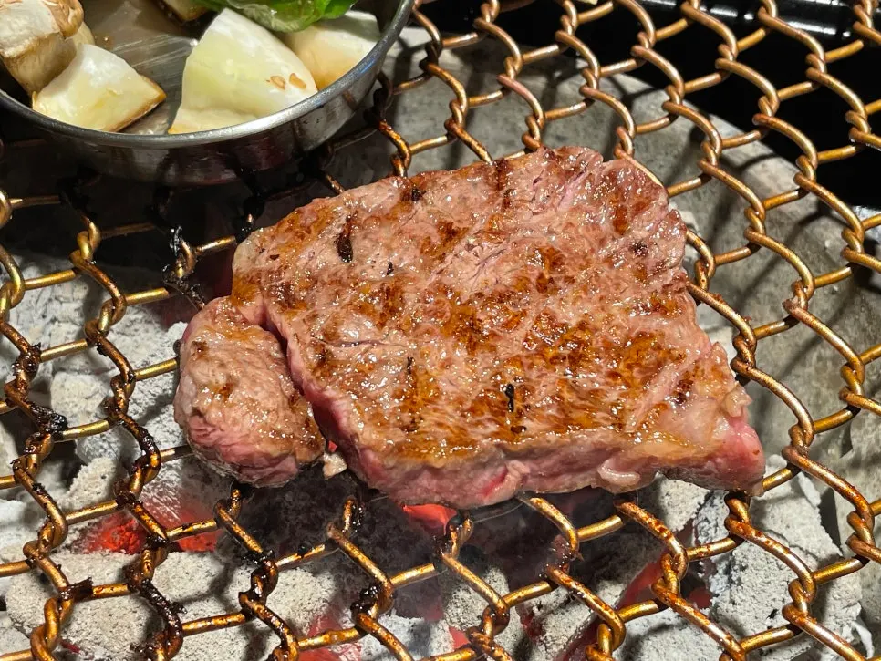 A tender piece of grilled salchisal