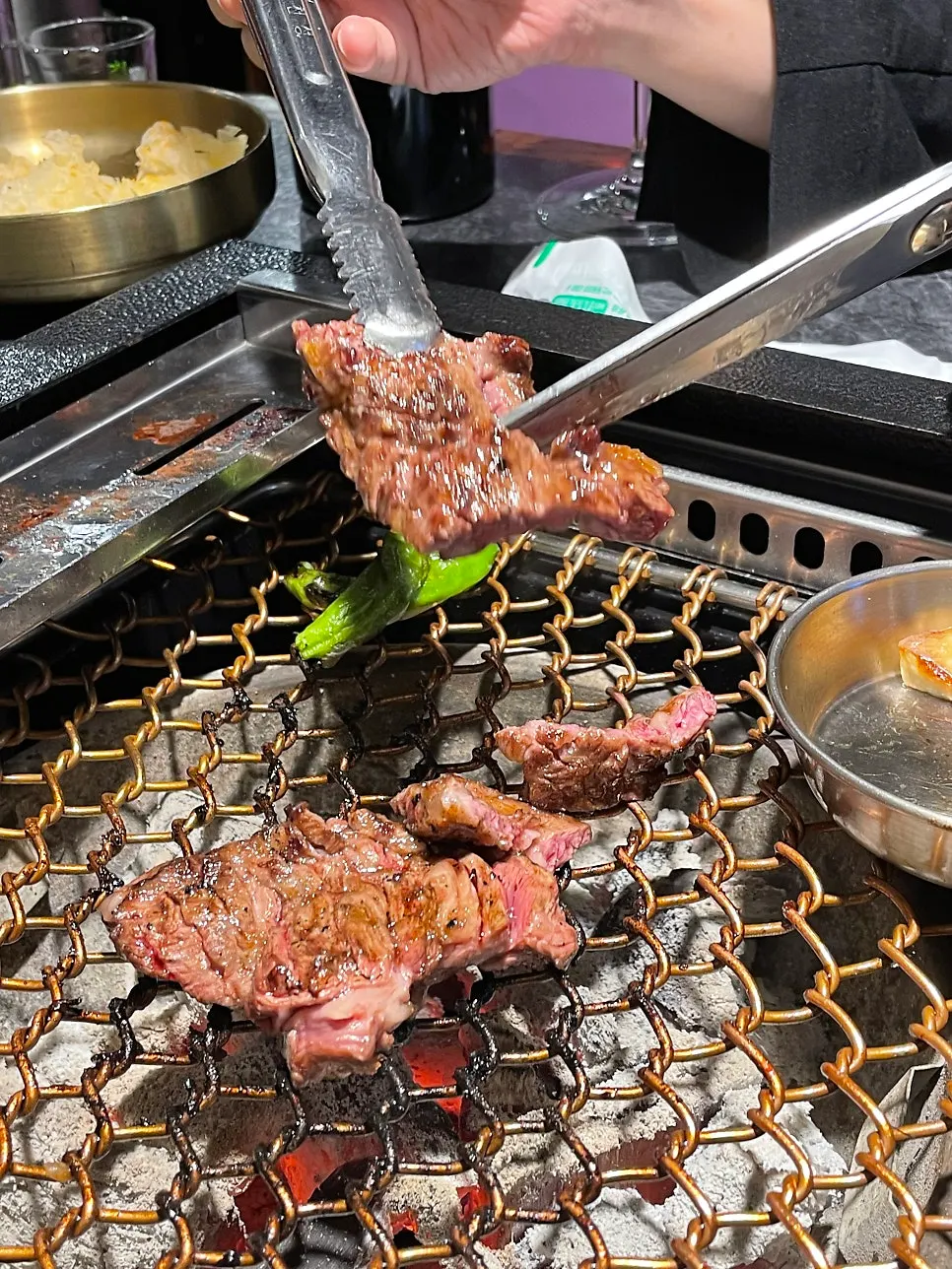 Top sirloin and whole short rib cooking on the grill