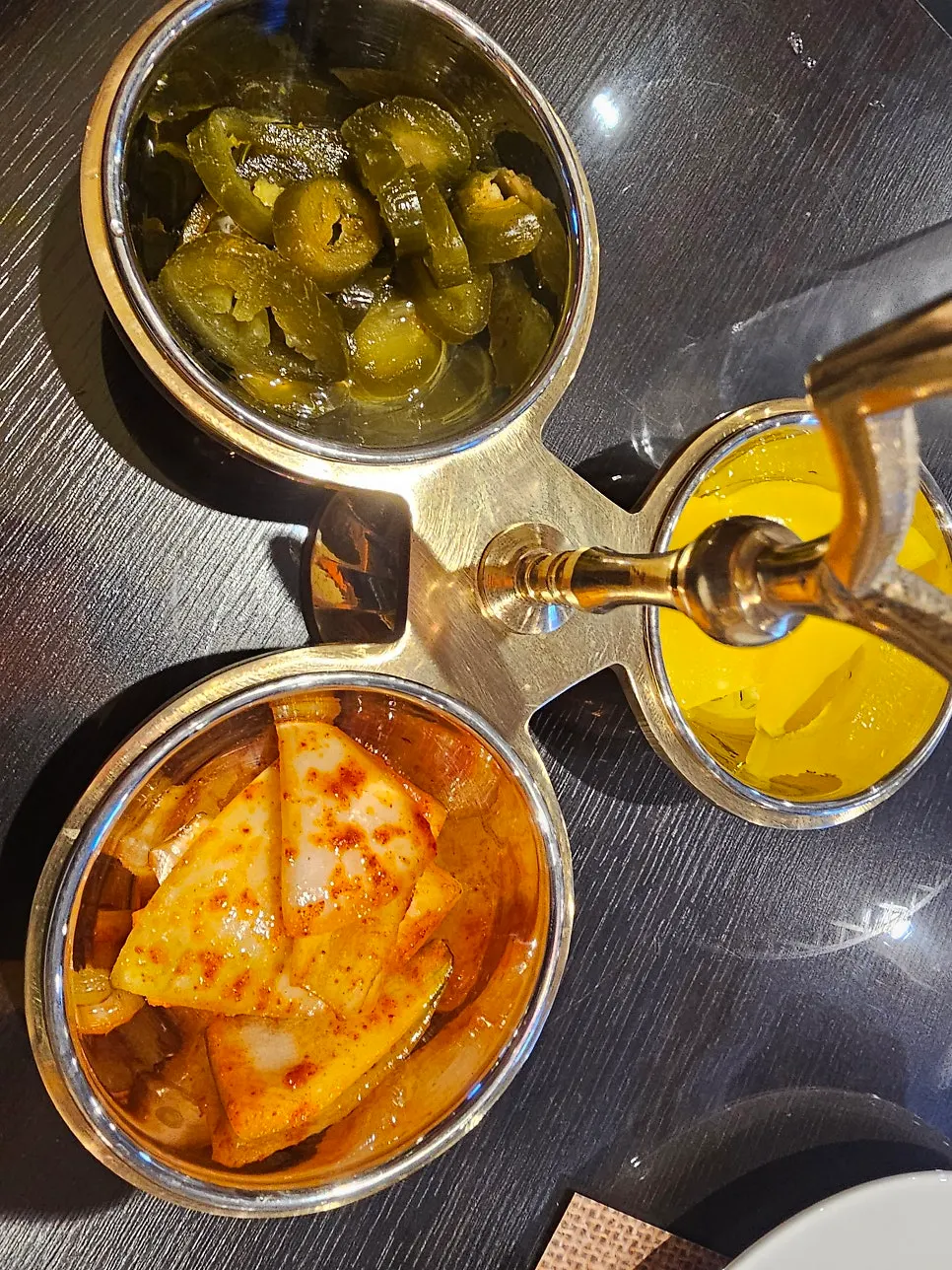 A plate of basic side dishes at India The Durbar