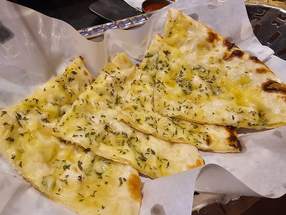 Cheese naan topped with a sweet syrup