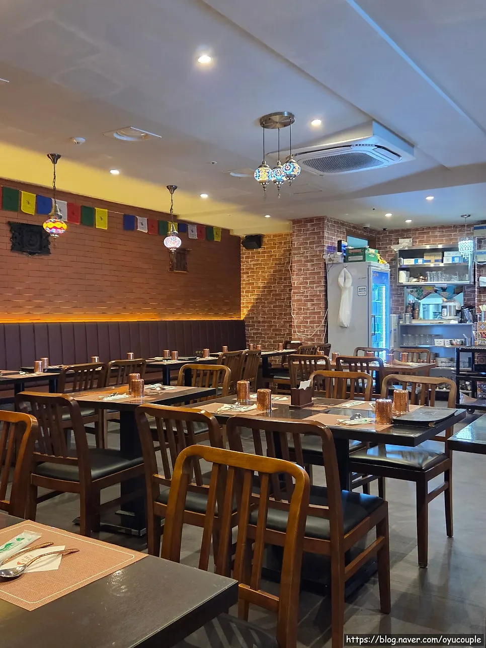 Comfortably spaced table seating at India The Durbar