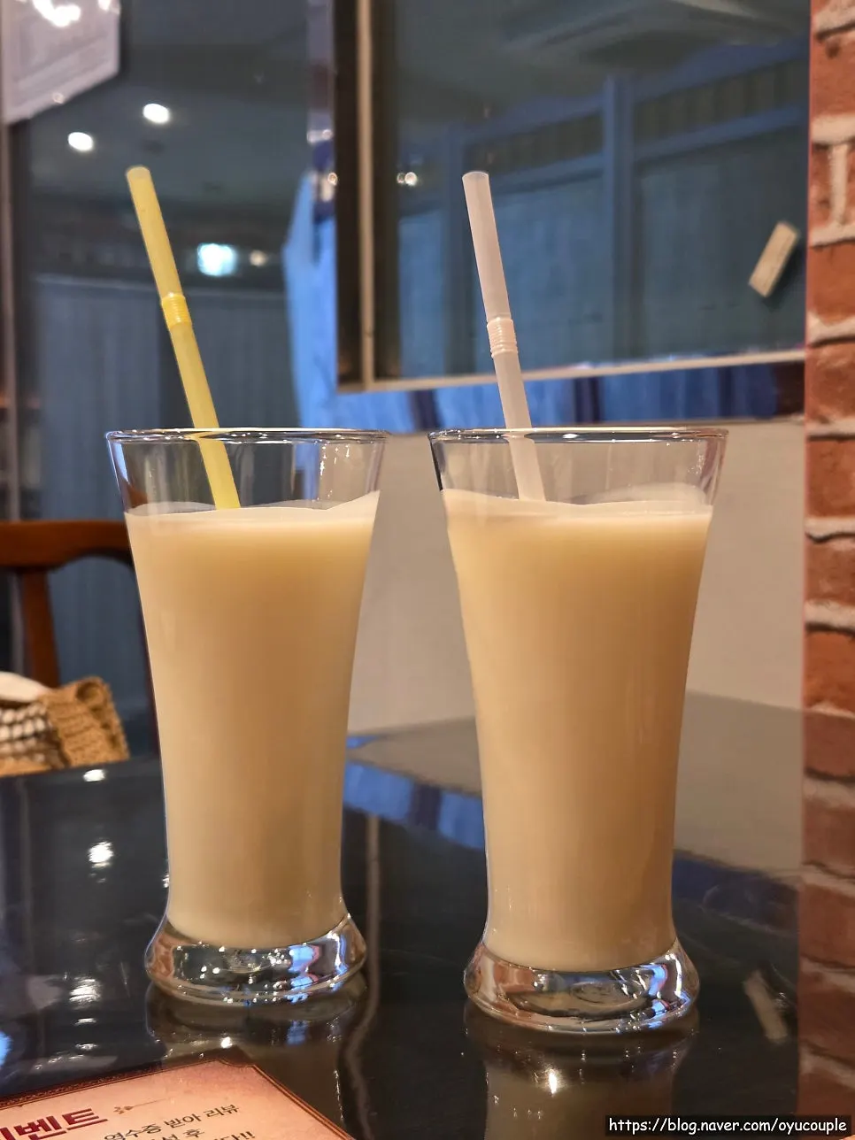 A glass of plain lassi served at the end