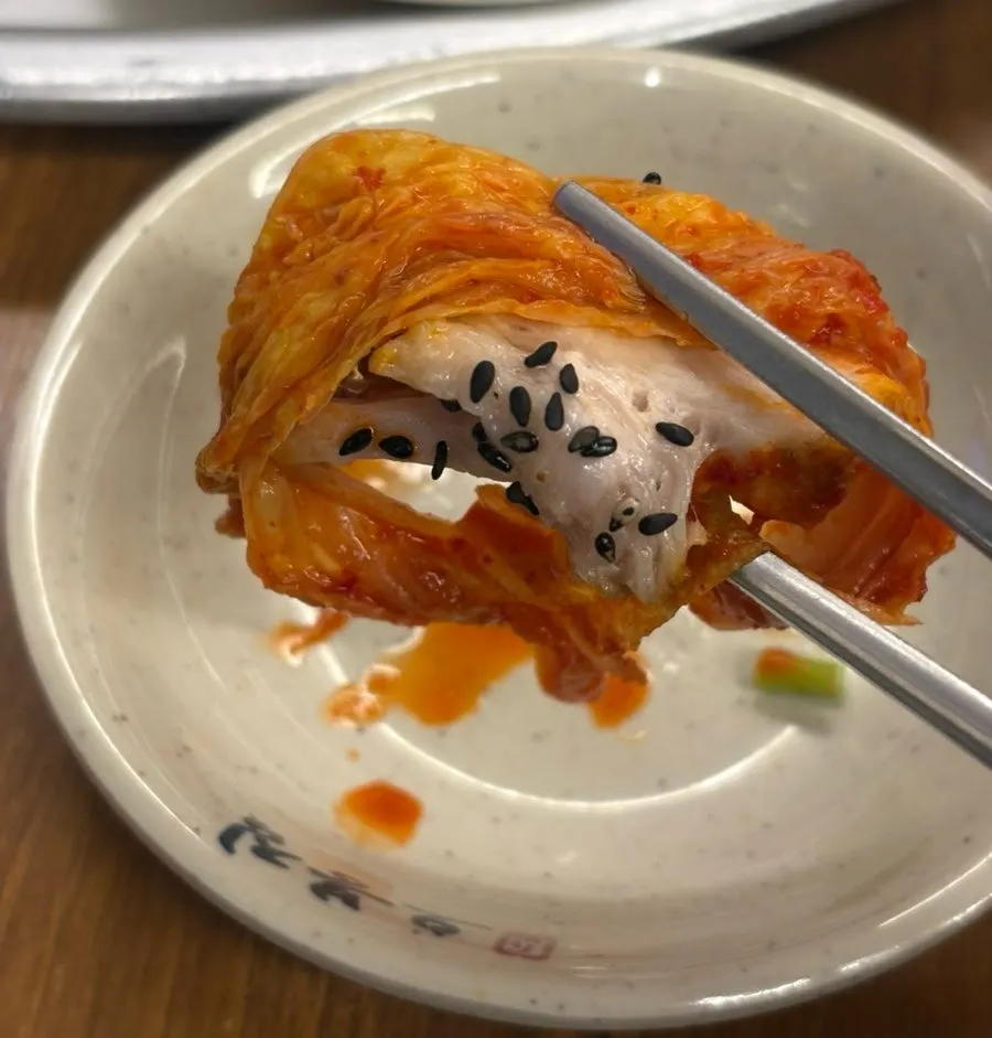 A piece of Obongjip's boiled pork with salted shrimp