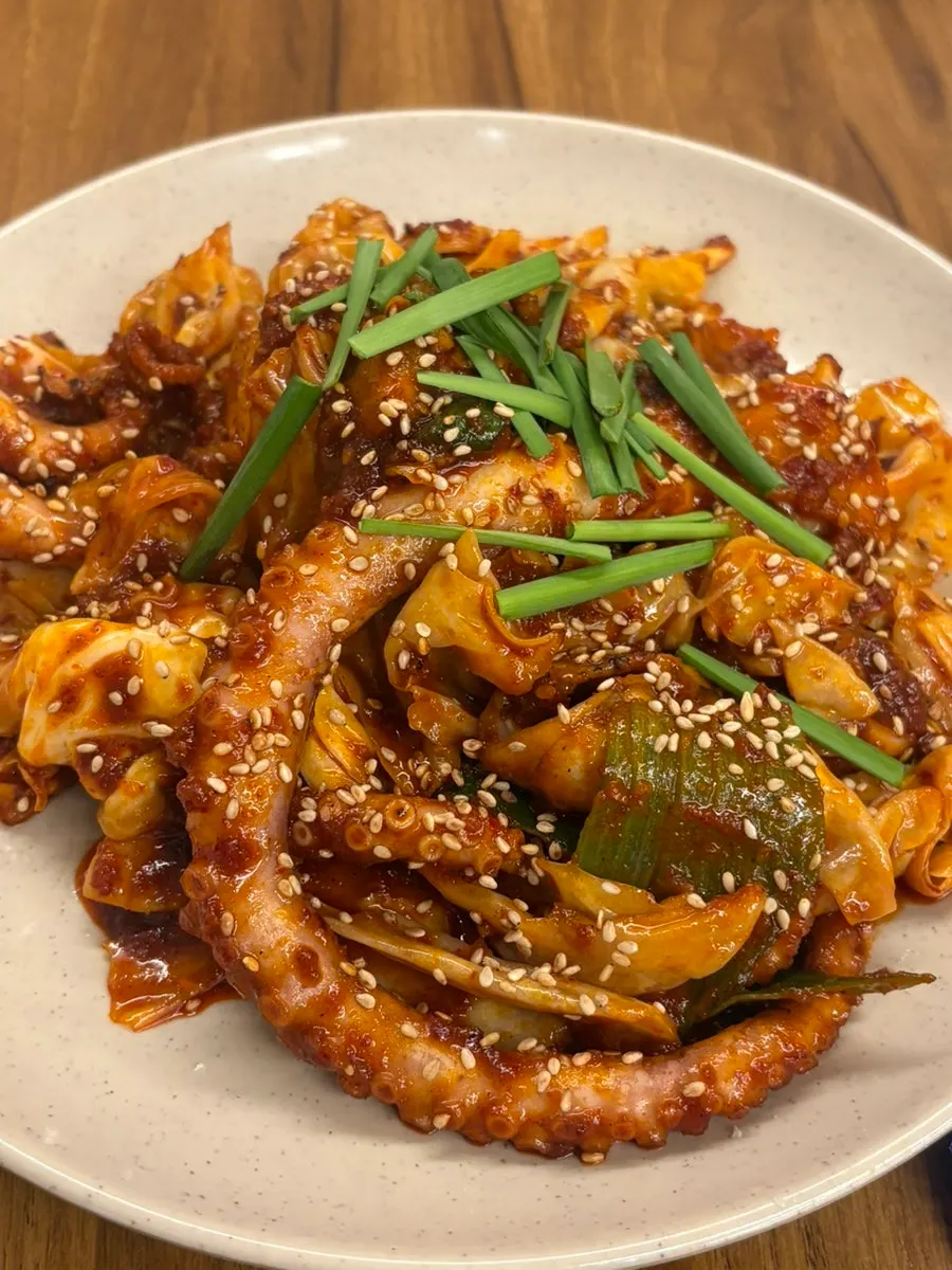 Fire-grilled octopus stir-fry with smoky char at Obongjip