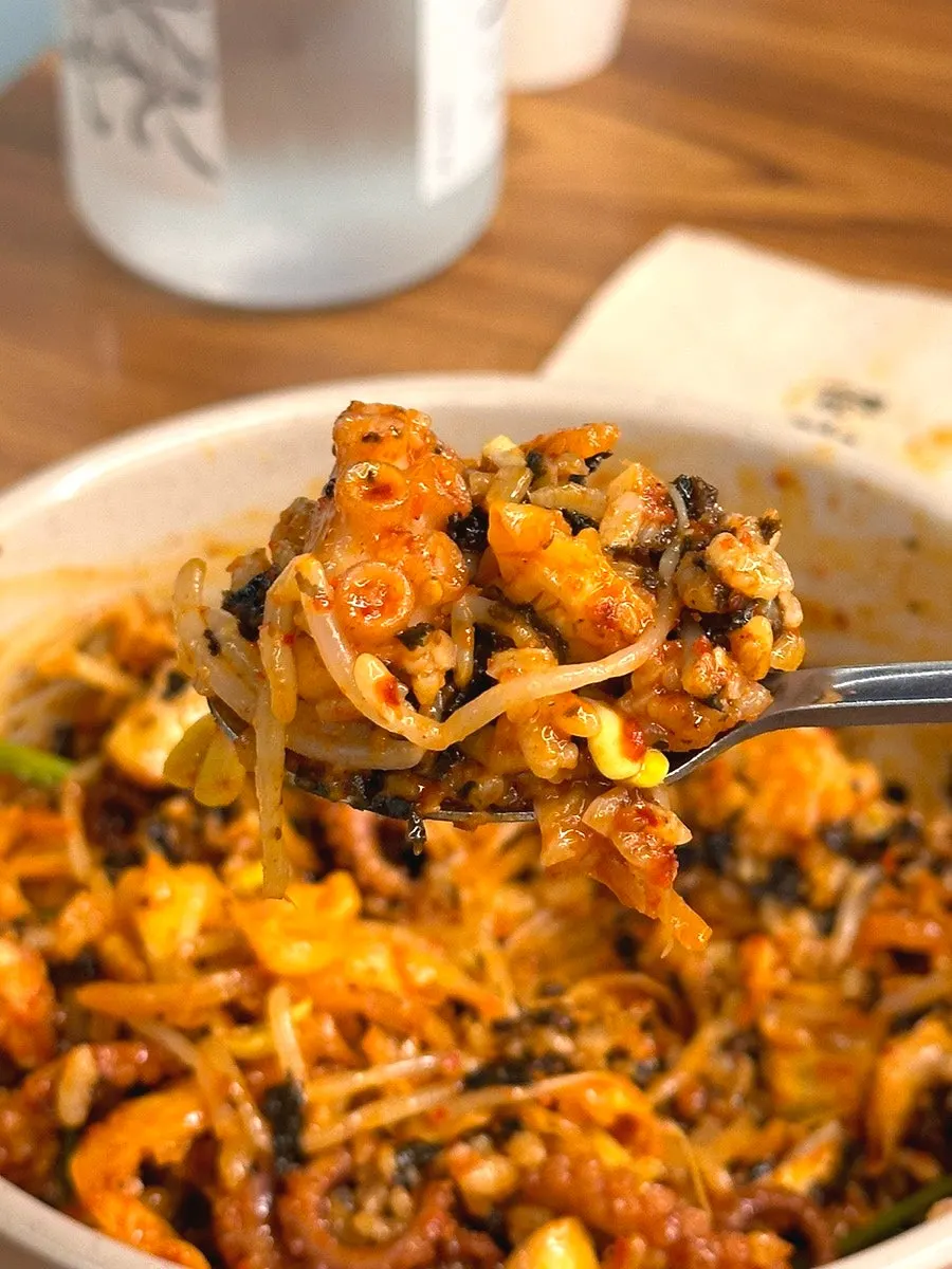 Mixed rice topped with octopus stir-fry