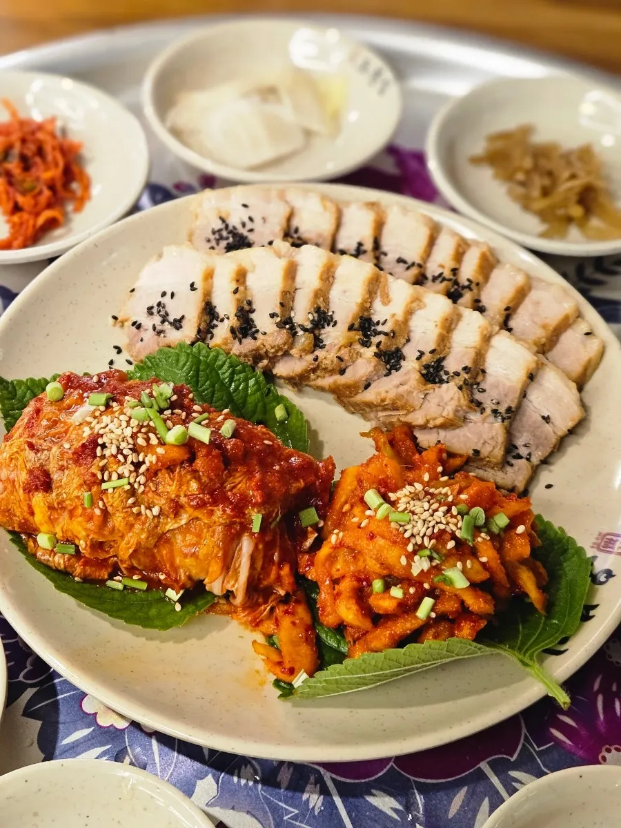A spoonful of rice topped with bossam pork
