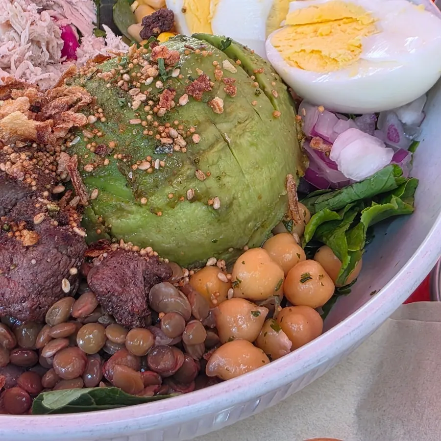 Poke ingredients mixed with lentils and chickpeas