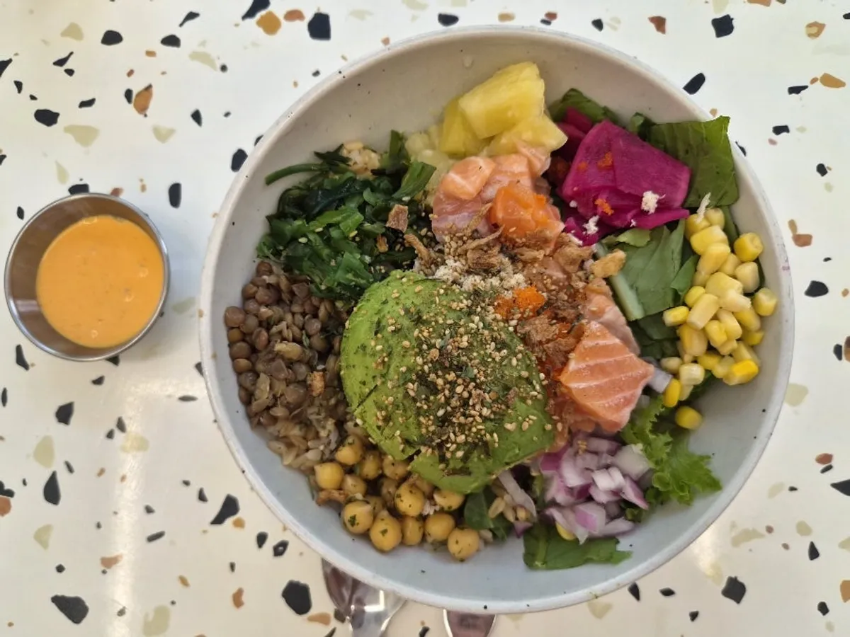 Colorful salmon avocado poke bowl