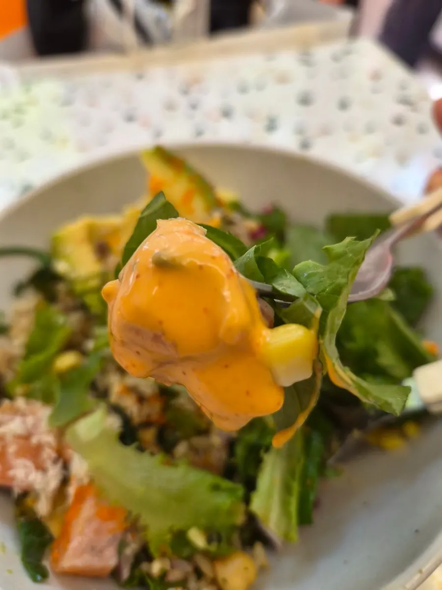 A spoonful of poke mixed with sauce