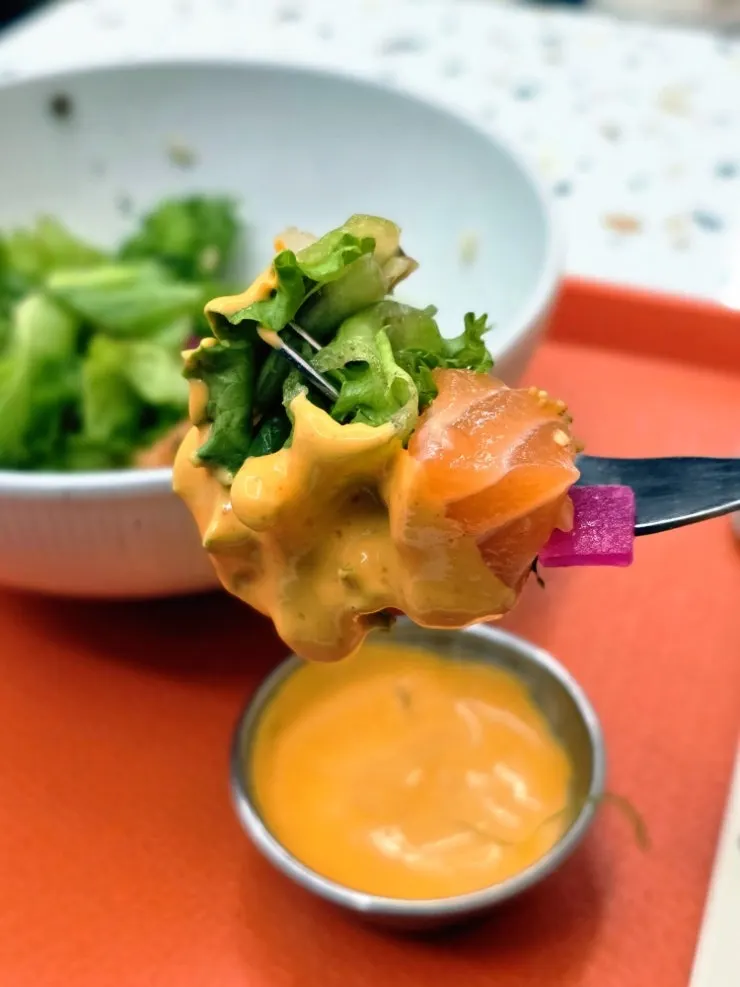 Sriracha sauce and fresh salmon poke