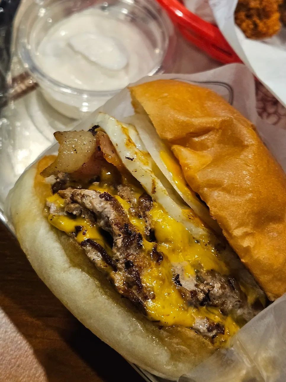 Close-up of the bitten patty and cheese layers