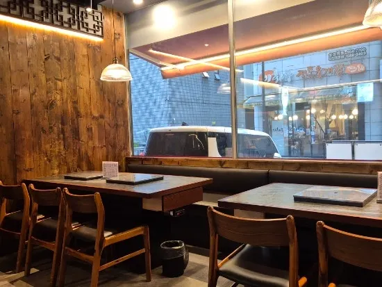View of the dining hall tables at Gungmin Hanwoo House Samseong branch