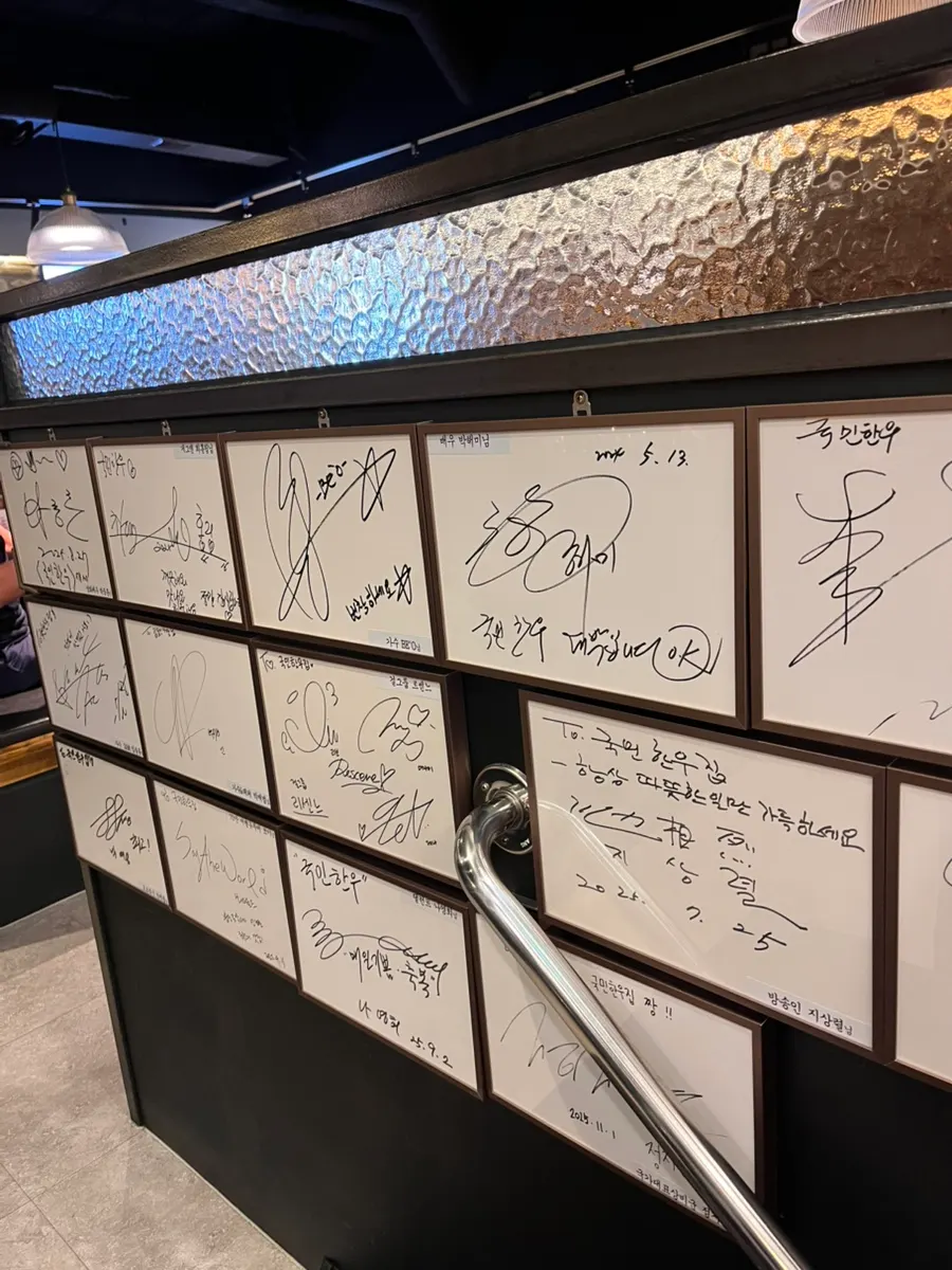 Photos of celebrity visits displayed in the restaurant