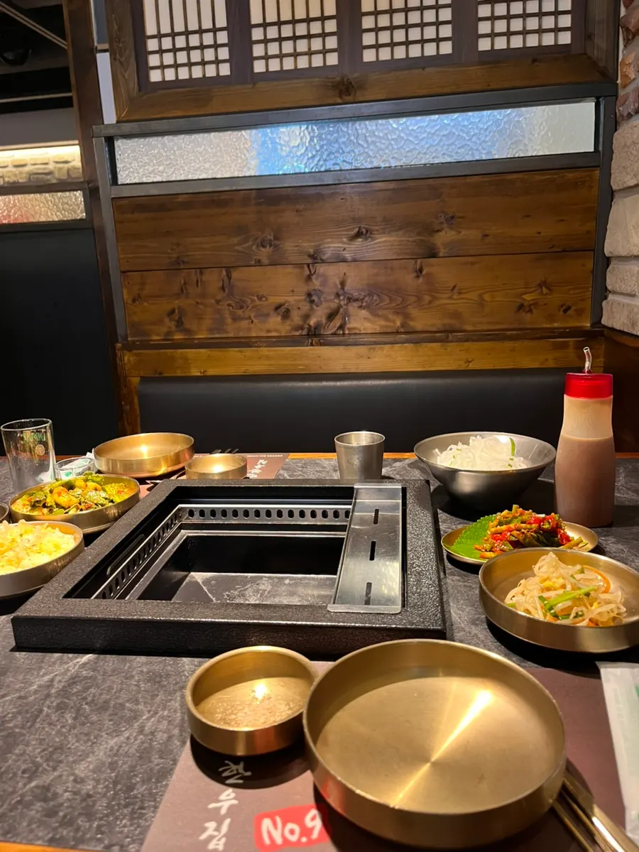 Charcoal grill and table setting at the seat