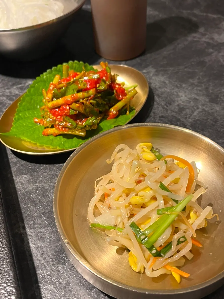 Banchan set including wood ear mushrooms and fresh kimchi