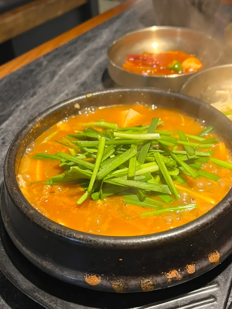 Hanwoo brisket doenjang jjigal served in a large stone pot