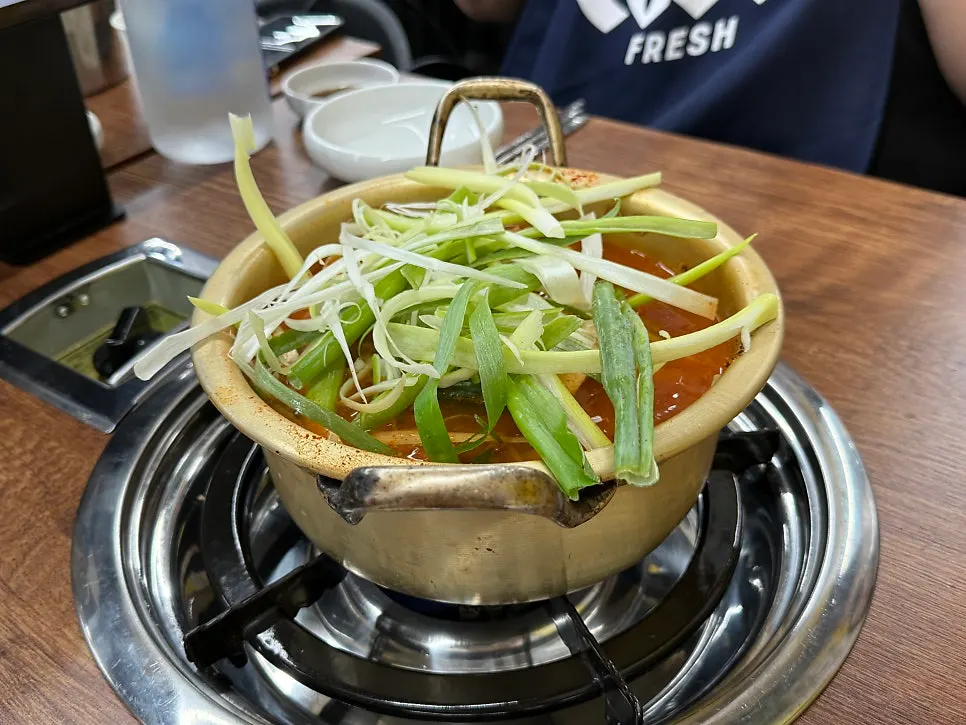 Spicy pollack soup simmering at the table