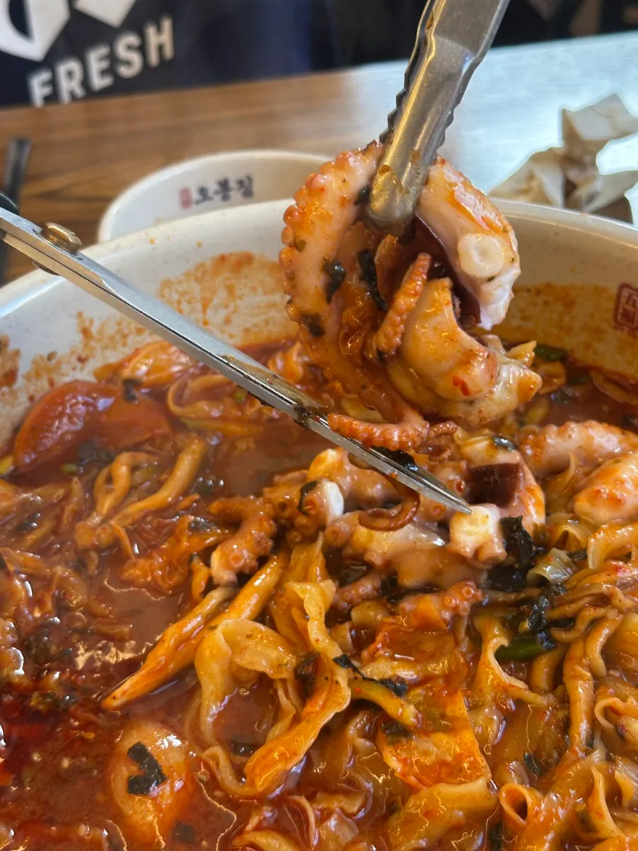 Knife-cut noodles coated in sauce, resembling dosakmyeon