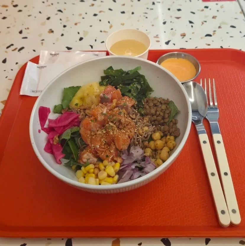 A colorful bowl of raw salmon poke