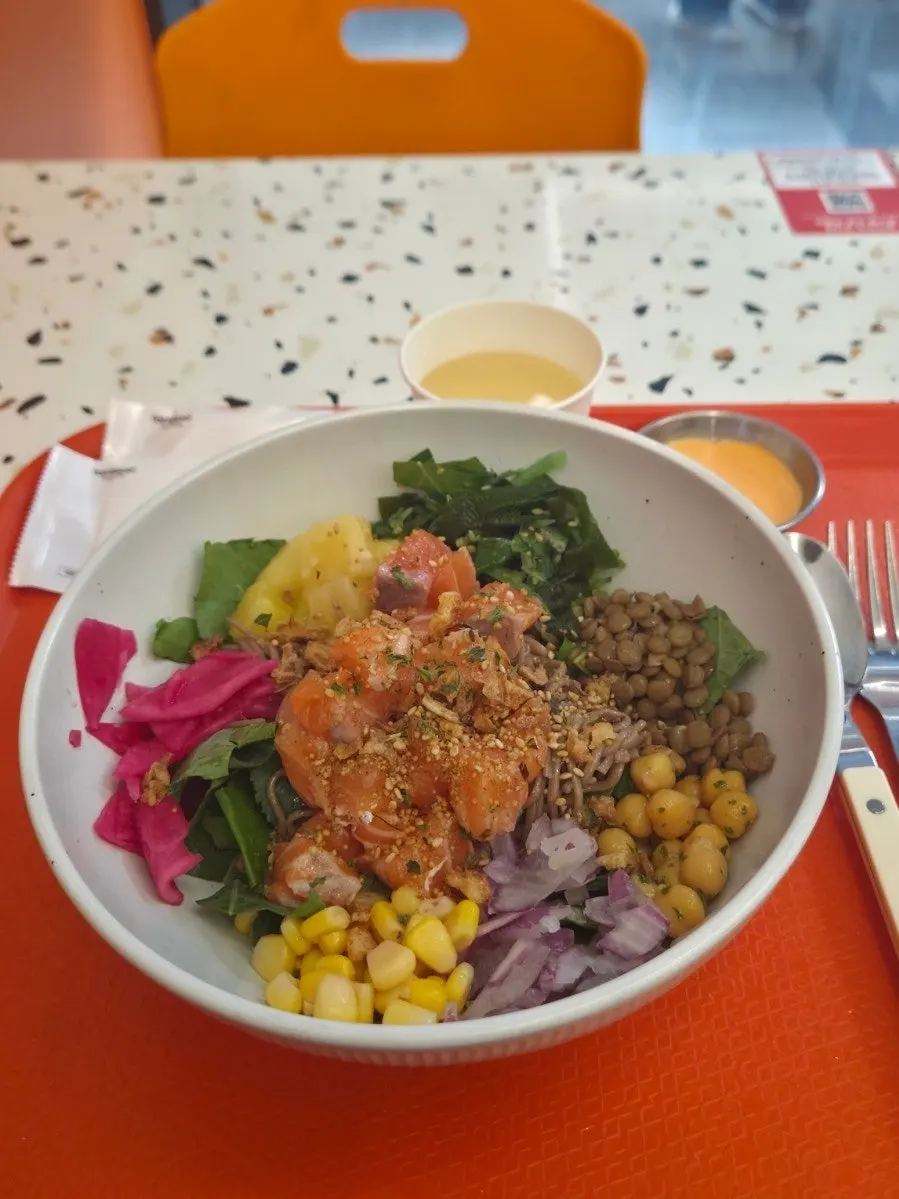 Raw salmon poke topped with sriracha mayo