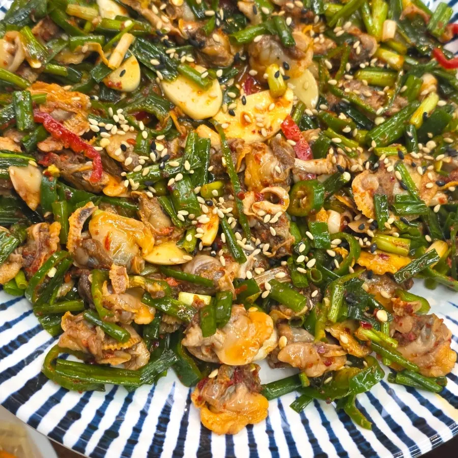 Close-up of cockles mixed with vegetables