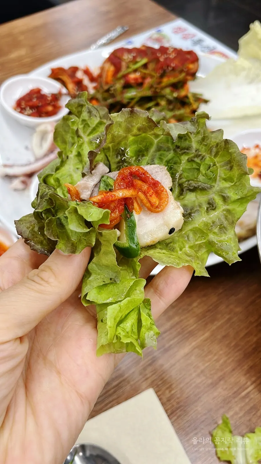 Inner cabbage wrap topped with salted oyster