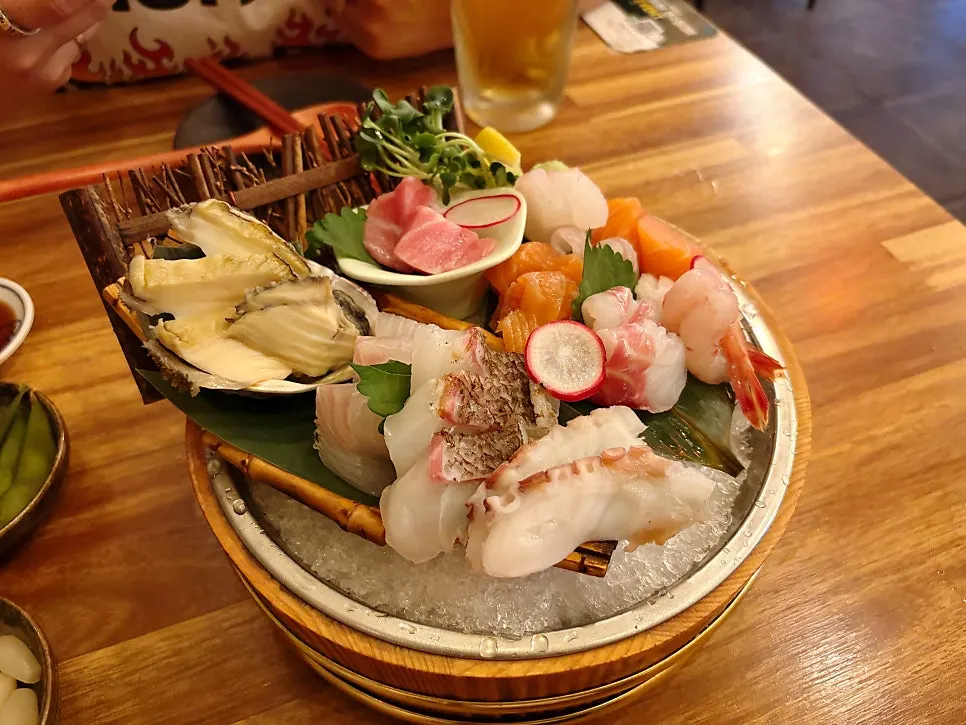 Complimentary snacks before the seasonal sashimi arrives