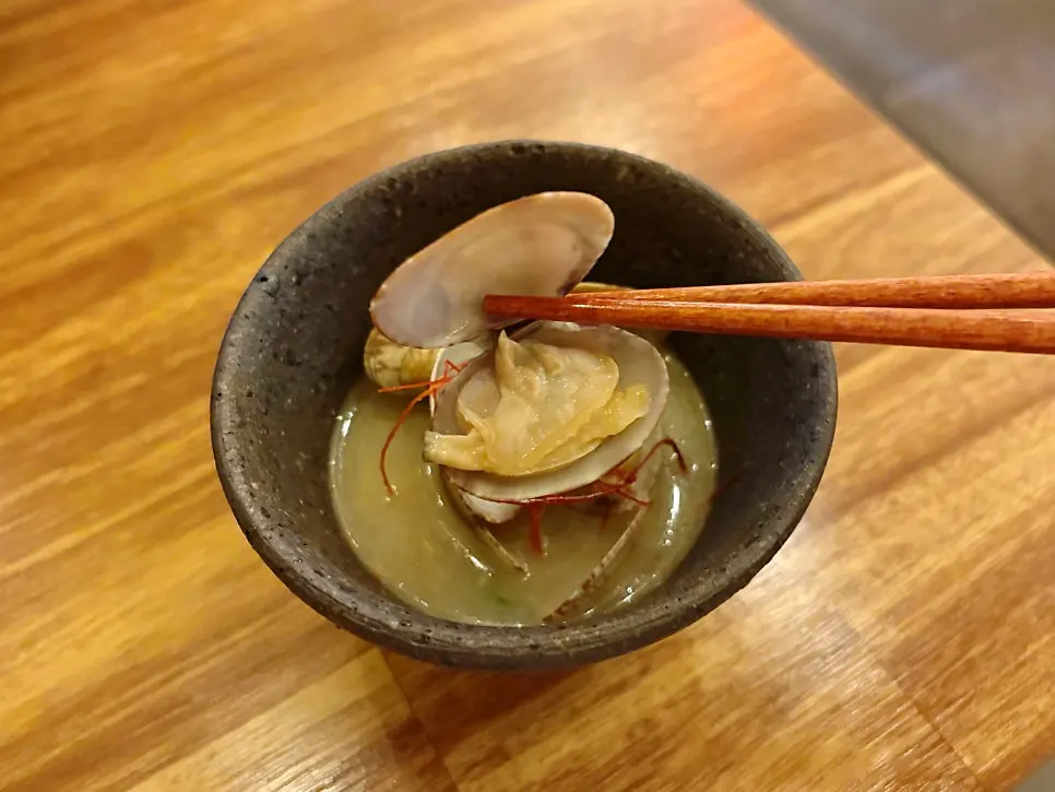 Warm clam sake steam served with sashimi