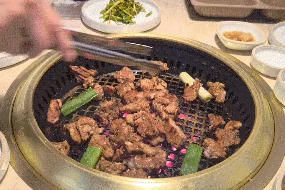 Staff grilling marinated galbi