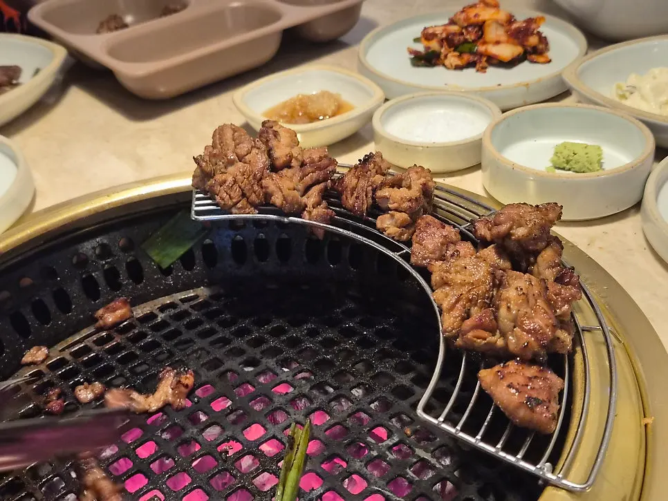 Marinated galbi topped with scallion salad and wasabi