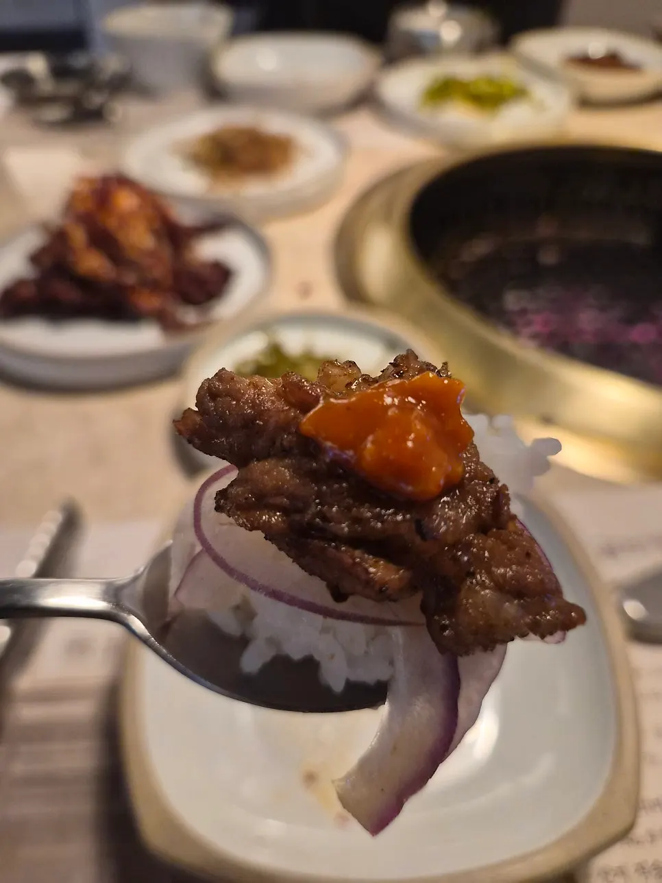 A bite of hot rice and marinated galbi