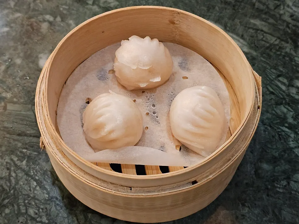 Two kinds of dim sum: handmade xiaolongbao and shrimp hagau