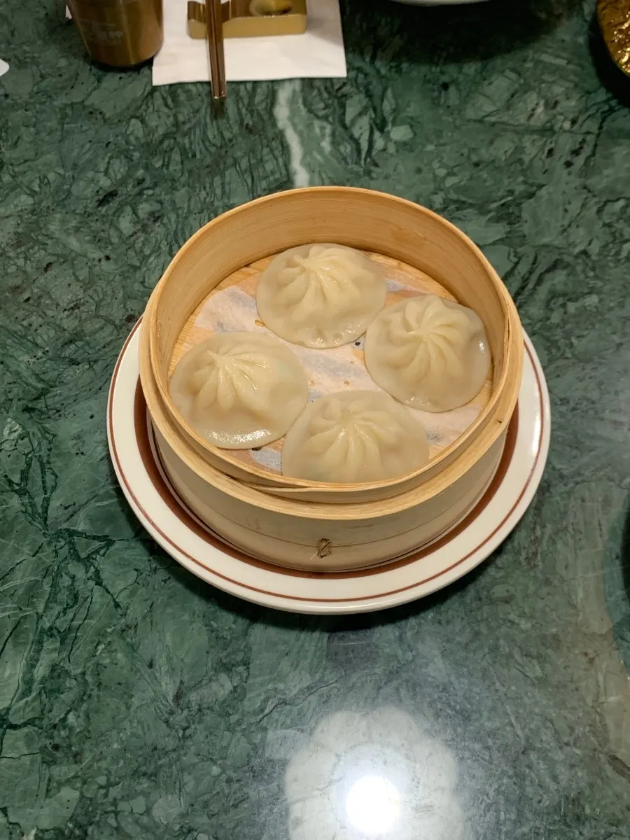 Steamer basket of Samsin's handmade xiaolongbao served at the table