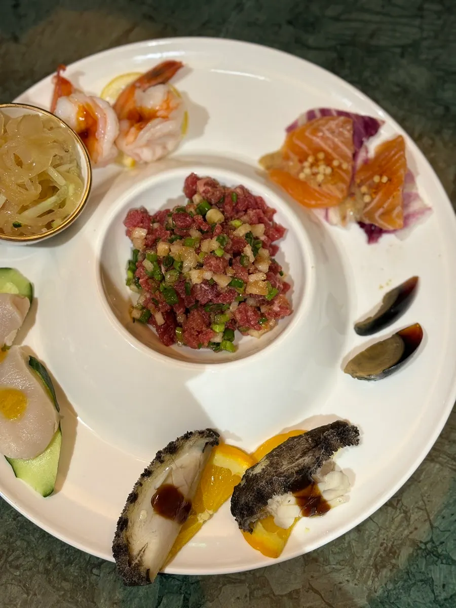 Samsin cold platter topped with salmon and abalone