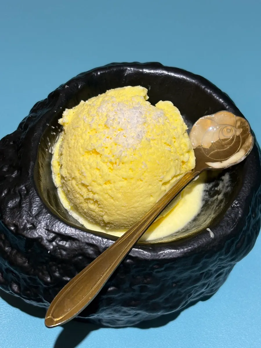 A bowl of strongly mango-flavored sorbet